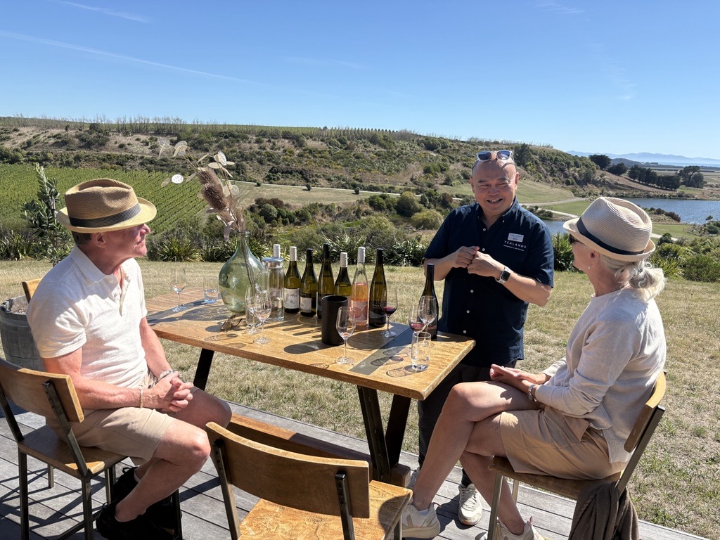 Billy Kaare and Linda - VIP container - tasting with backdrop